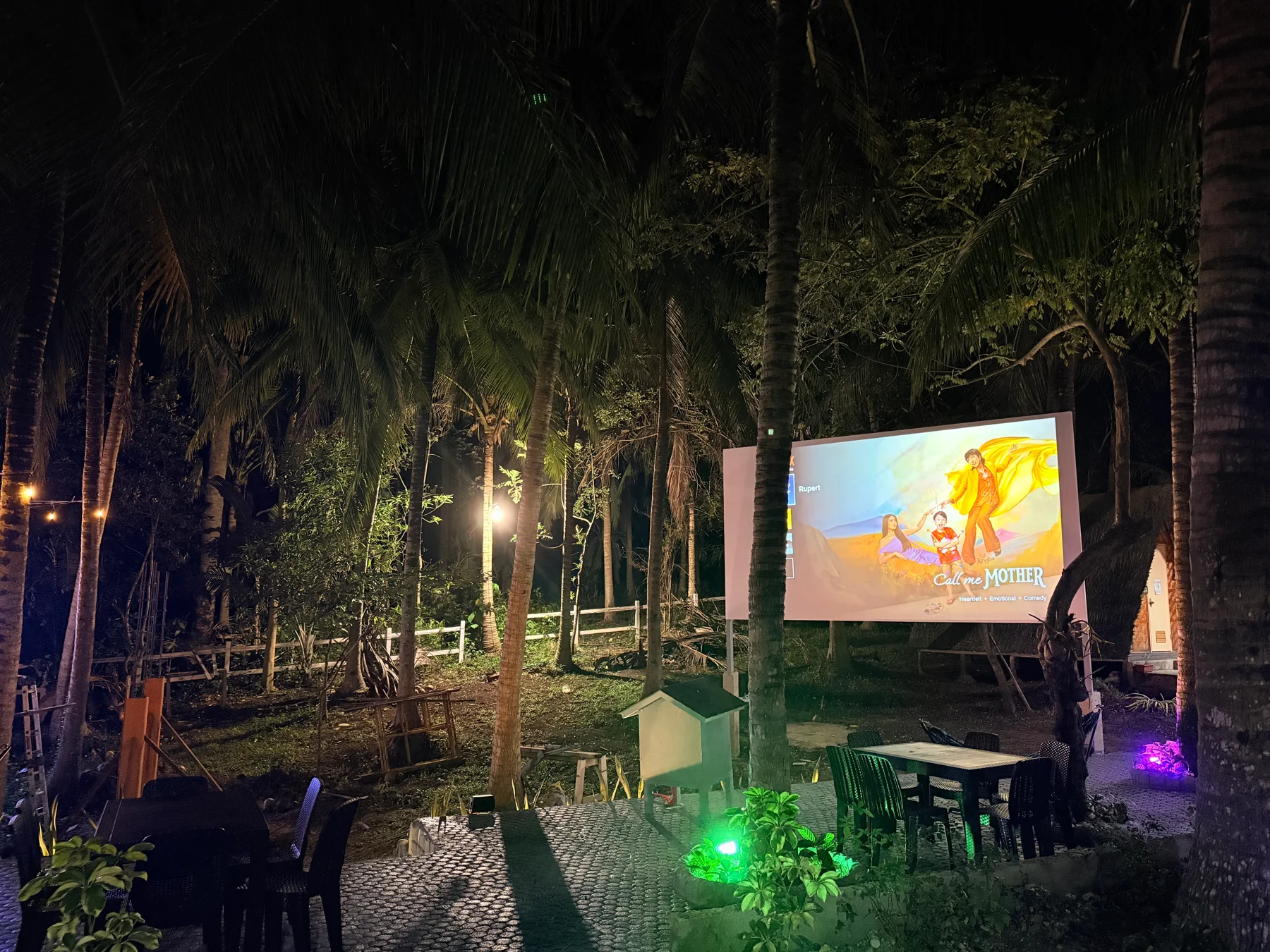 Outdoor movie night beneath the trees at Starksway Resort