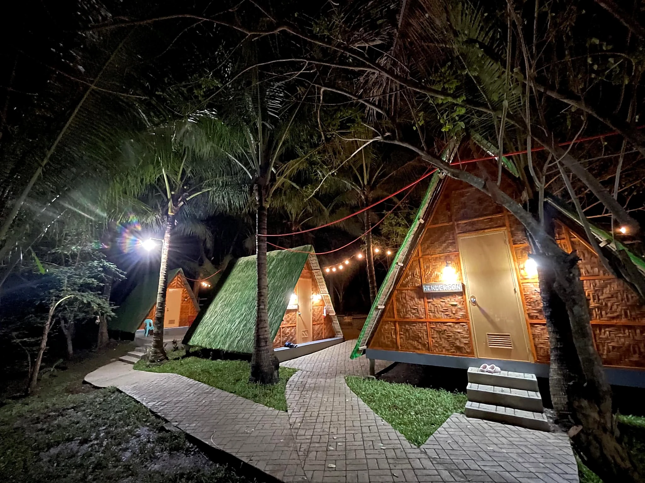 Starksway Resort A-frame cabins and outdoor lights at night
