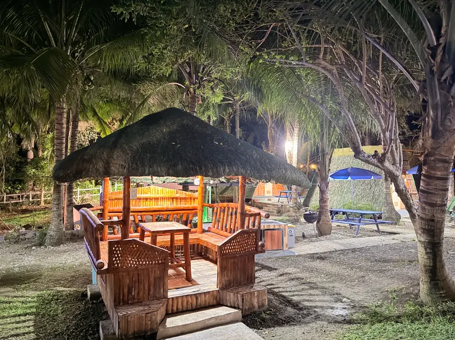 Bamboo cottage illuminated at night